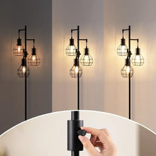Black standing floor lamp with multiple caged shades in a vertical tree design
