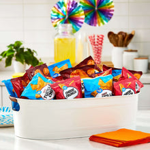 White tub filled with assorted tortilla chips, variety bag corners visible