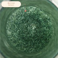 Green mottled glass vase interior with bubble-like textured pattern