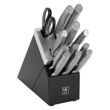 Self-sharpening knife block with gray knives and kitchen shears in slots