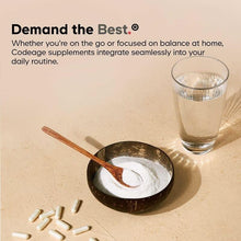 Liposomal vitamin C supplement concept with glass of powdery drink and scattered capsules