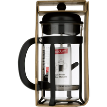 Black French press in retail packaging, with glass carafe and curved handle.