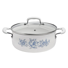 White ceramic stockpot with blue floral design and clear glass lid