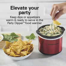 Red party dipper food warmer with metal rim and creamy dip in the removable crock