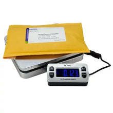 Postal shipping scale with yellow padded mailer on platform and blue display reading 0.23