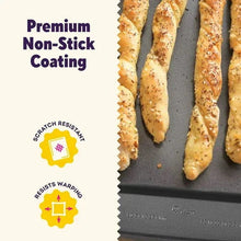 Non-stick coated baking tray with bread slices and scratch-resistant icon.