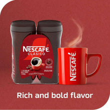Nescafé Clasico instant coffee canisters with red mug, dark brown canisters and crema drink