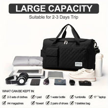 Black quilted duffel bag with large main compartment and multiple front pockets