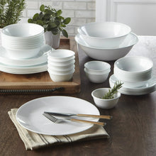 White glass dinnerware set assortment: dinner plates and bowls