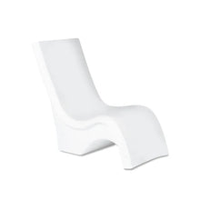 White tall lounge chair, curved back and thick seat in an angled side view.