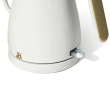 White electric kettle base with gold logo and lever switch