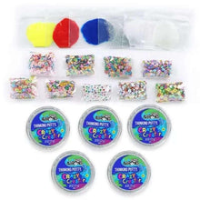 Thinking putty tins with colorful lid labels and small glittery mix-ins packets