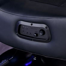 Black gaming chair seat control panel with ports and button controls