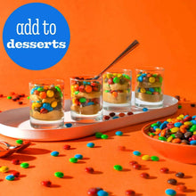Dessert cups topped with colorful M&M candies