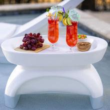 White round side table with integrated serving tray, holding drinks and snacks