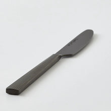 Black stainless steel knife with ridged handle