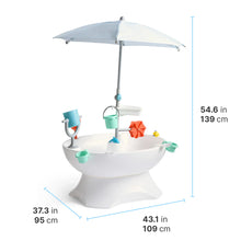 Outdoor water play table with light-blue umbrella canopy and colorful splash accessories