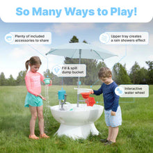 Outdoor misting water play table in grass with children filling and splashing