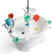 White splash table top with colored buckets, orange umbrella, and canopy support pole