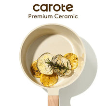 Cream ceramic nonstick saucepan with wood-look handle, filled with eggs and herbs
