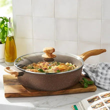 Brown speckled saute pan with glass lid, wood knob, and wood side handles