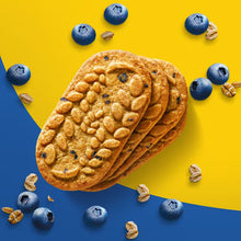 Crunchy blueberry breakfast biscuits stacked, with visible oats and blueberries