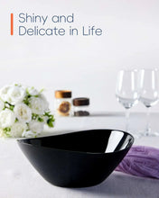 Black ribbed oval serving bowl with glossy interior, empty