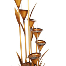 Copper fountain tiers with tall tubes and shallow cups, water pouring