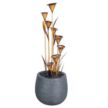 Copper multi-tier fountain in a round dark pot with water droplets