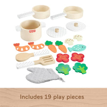 Wooden pots and pans set with cookware, utensils, and colorful pretend food pieces