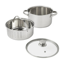 Stainless steel steamer pot with perforated basket and separate glass lid.