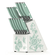 Kitchen knife set with mint green handles and floral decal acacia block, angled view