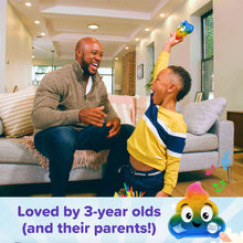 Rainbow poop character hide-and-seek toy held up by a child indoors