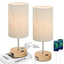Two touch table lamps with cream shades, wood bases, and touch control phone graphic