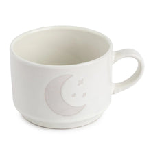 Ceramic coffee mug in white with crescent moon and star design, side handle