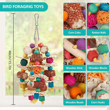 Hanging bird foraging toy with corn cob, rattan balls, rope, and colorful wooden parts