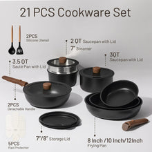 Nonstick cookware set with pots, frying pans, steamer, and silicone utensils, laid out