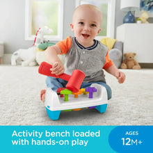 Tap and turn activity bench toy with colorful tools, toddler playing