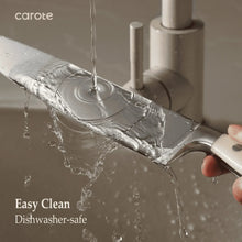 Stainless steel knife being rinsed in water for easy cleaning