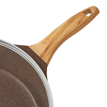 Brown speckled saute pan with long wood handle and silver rim