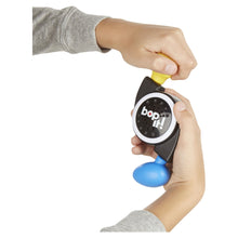 Bop It! micro series electronic game toy held by hands, yellow lever raised
