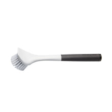 Angled sink brush with white bristle head and black soft-touch handle
