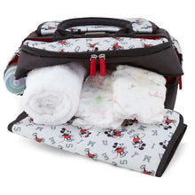 Disney Baby diaper bag with folded plush pad and Mickey Mouse print, black zipper trim