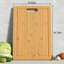 Bamboo cutting board with central hand slot and juice-groove channel design.