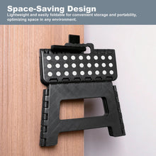 Foldable plastic step stool, black with dot-pattern top, shown folded for compact storage