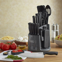 Rotating carousel knife and tool caddy with black-handled utensils and tool slots