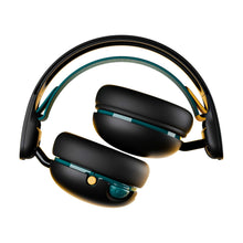 Black over-ear headphones with teal accents, adjustable headband, and padded earcups