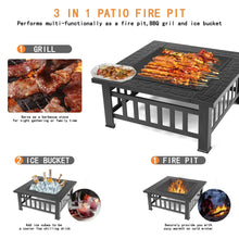 Black multi-use fire pit table with grill grate, flames, and cooking tools