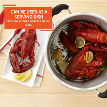 Aluminum stock pot used as serving dish with glass lid and side handles