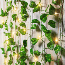 Leaf vine LED curtain lights with green foliage and warm white glowing bulbs